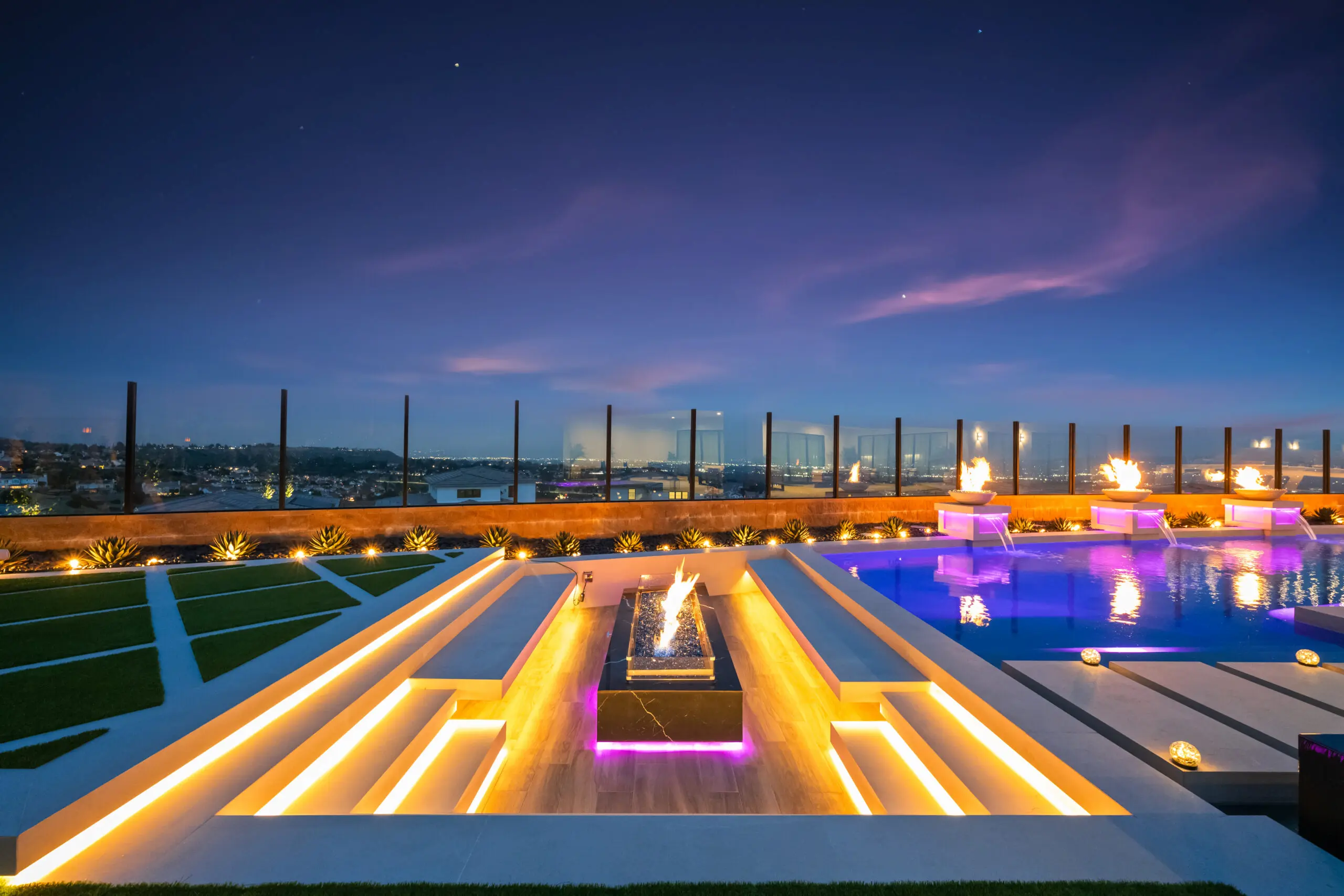 Pool contractors in Orange County - custom infinity pool, spa, and fire feature backyard design by Aquaterra Landscape